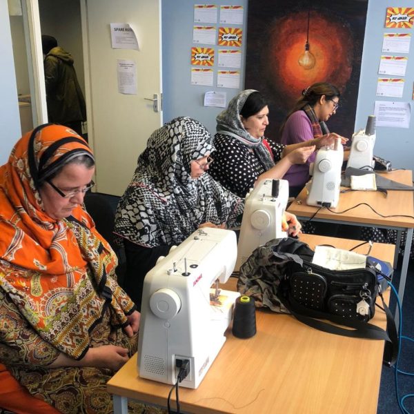 Amina History Women Sewing